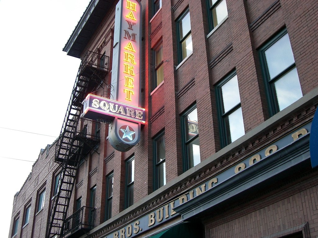 Haymarket Square neon sign on historic brick building in Lincoln, NE