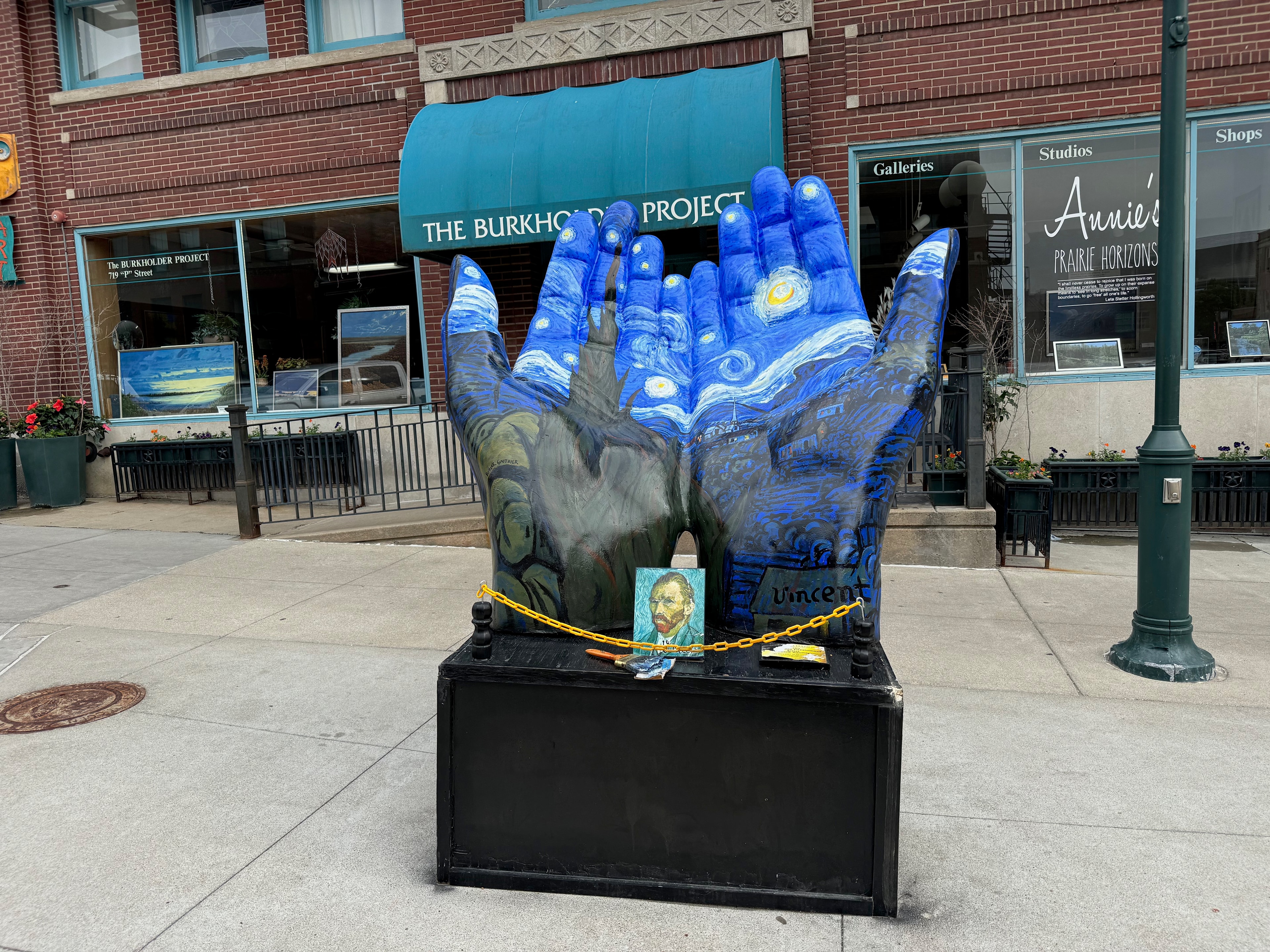 Van Gogh Starry Night painted hands public art sculpture outside The Burkholder Project in Lincoln NE