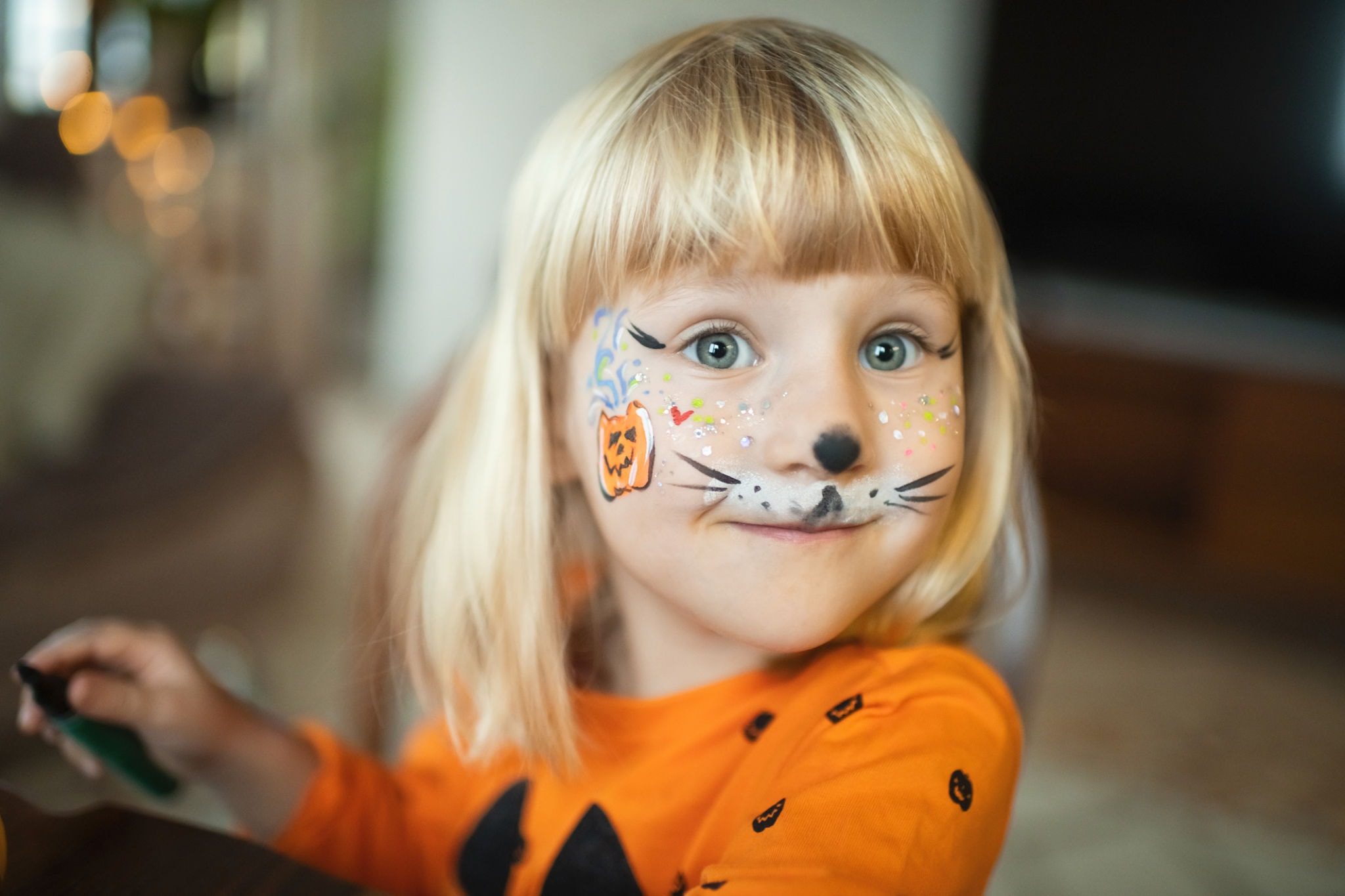 Child with festive face paint at the Haymarket Harvest fall festival